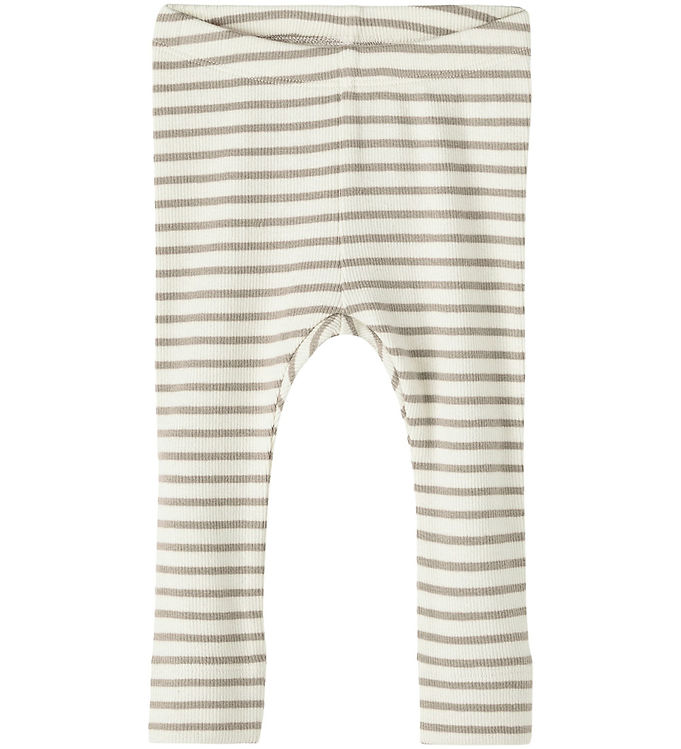Oplev Name It Leggings Rib Bani Pure Striber Cashmere – det perfekte valg til komfortabel og stilfuld påklædning. Disse leggings er fremstillet af blød, strækbar kvalitet, der sikrer en optimal pasform og bevægelsesfrihed, hvilket gør dem ideelle til leg og fritid. De fine striber tilføjer et trendy touch, mens det tidløse design gør det nemt at style med en række overdele. Et must-have til enhver garderobe!

- Blød og strækbar kvalitet
- Trendy ribbet design med striber
- Optimal pasform og bevægelsesfrihed
- Ideel til leg og hverdag
- Tidsløst og nemt at style
- Holdbar og let at vedligeholde